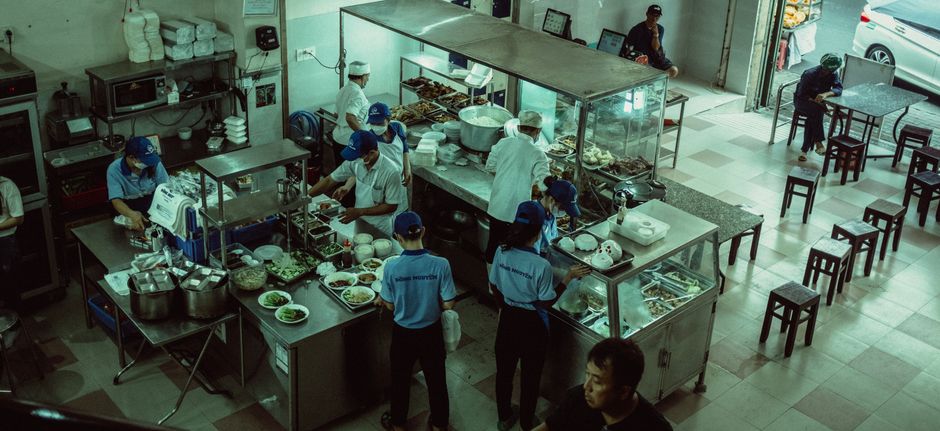 Professional pizza restaurant kitchen with oven and fresh ingredients